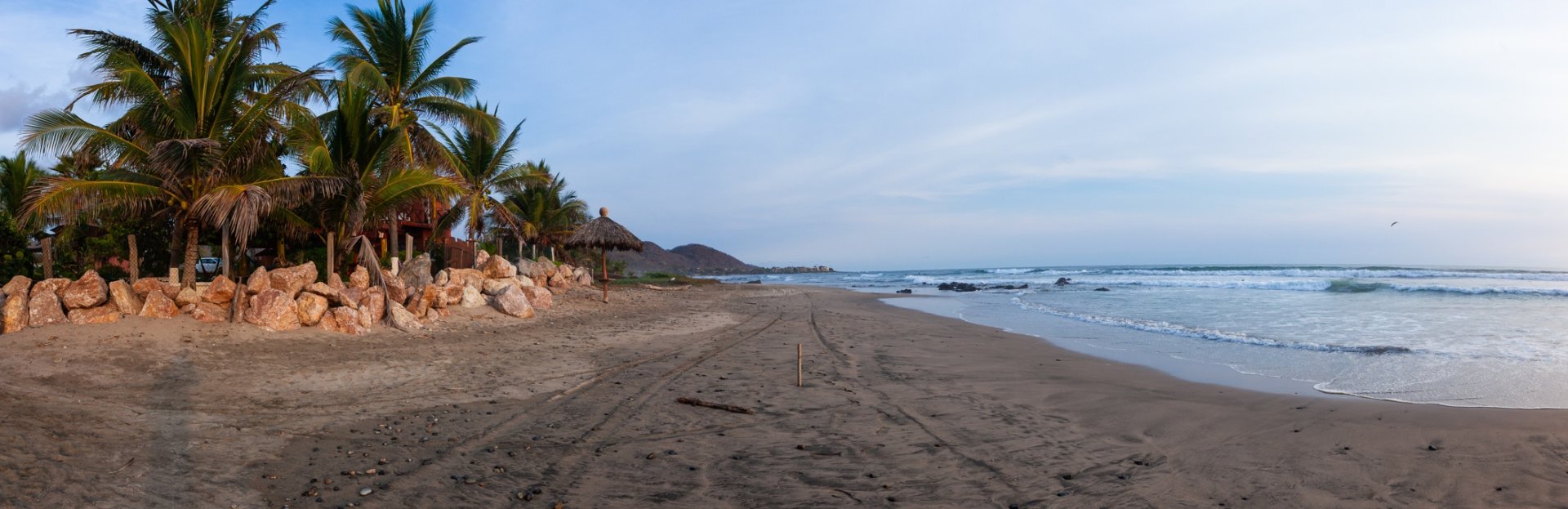 Sunset over La Majahua beach with the Sierra Madre mountains in the background, Guerrero Pacific Coast, Mexico